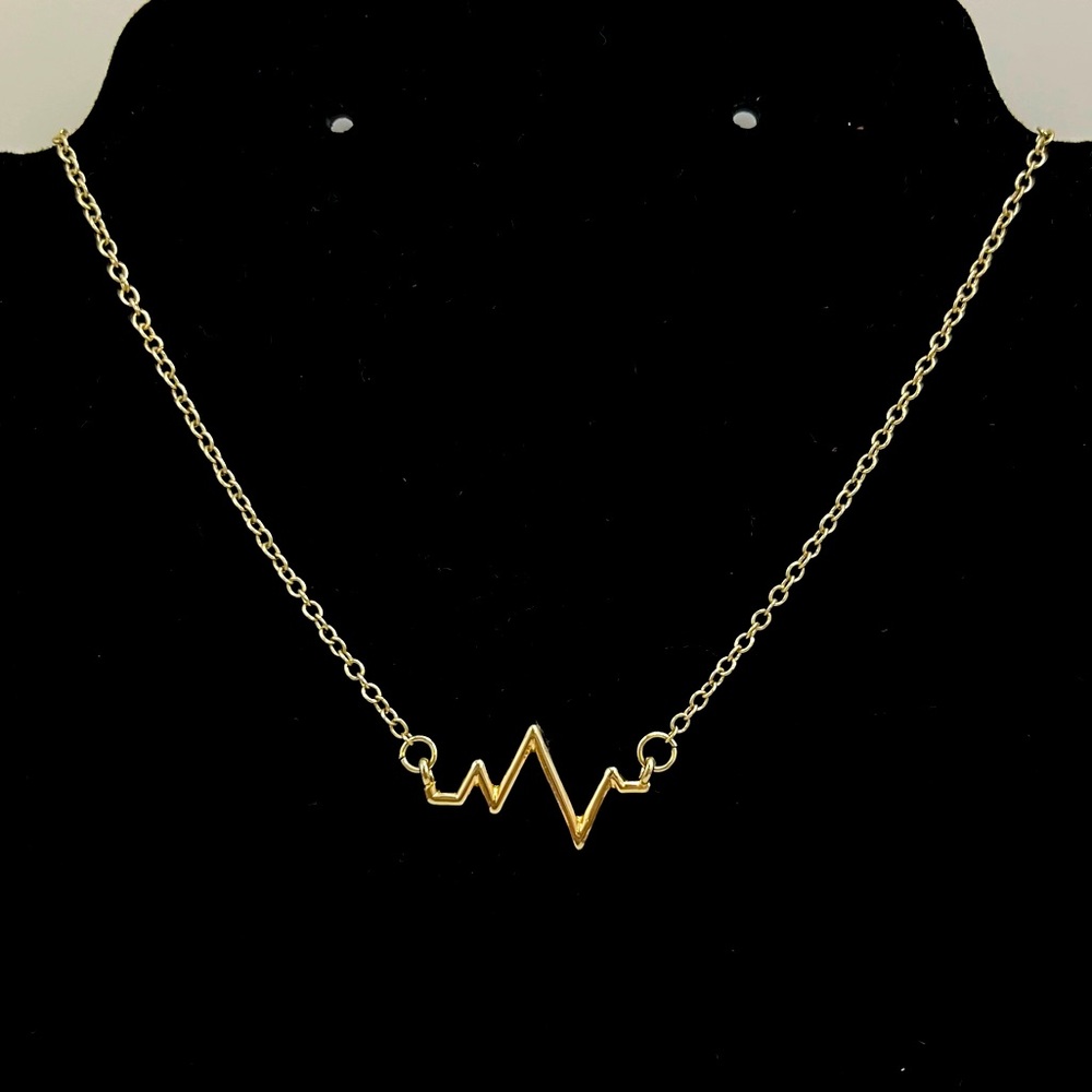 Charming Charlie Gold Tone Heartbeat Necklace